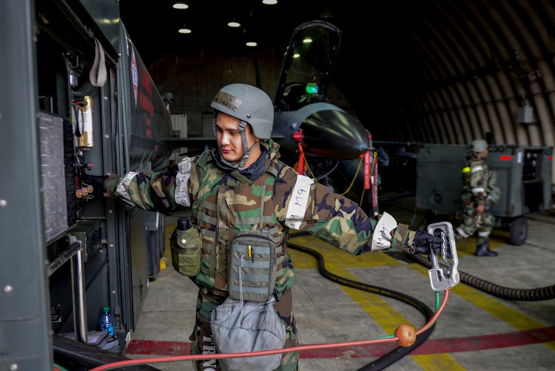 Senior Airman Elijah Padilla, 51st Logistics Readiness Squadron, adds fuel to F-16 Fighting Falcon during Beverly Midnight 16-01 exercise, March 8, 2016, at Osan Air Base, Republic of Korea. The challengingly high operational tempo of Beverly Midnight 16-01 along with the influx of additional personnel creates many logistical hurdles including the accurate allocation and timely delivery of fuels to aircraft. (U.S. Air Force photo by Staff Sgt. Jonathan Steffen/Released)