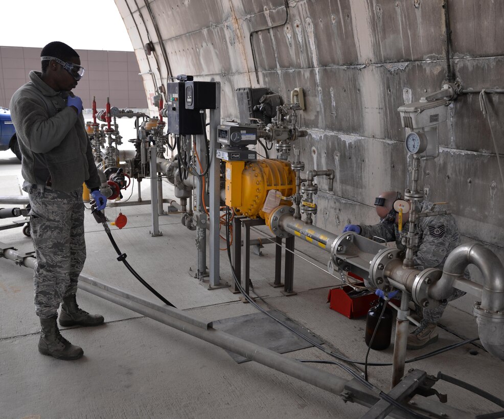 Airman 1st Class Kevin Linton, 51st Logistics Readiness Squadron laboratory technician, and Tech. Sgt. Jason Bello, 51st LRS fuels laboratory NCO in charge, perform real-world fuel testing March 8, 2016, at Osan Air Base, Republic of Korea. During readiness exercise Beverly Midnight 16-01, members from the petroleum, oils and lubricants section pull double duty by meeting both real-world and exercise mission requirements. (U.S. Air Force photo by Staff Sgt. Benjamin Sutton/Released) 