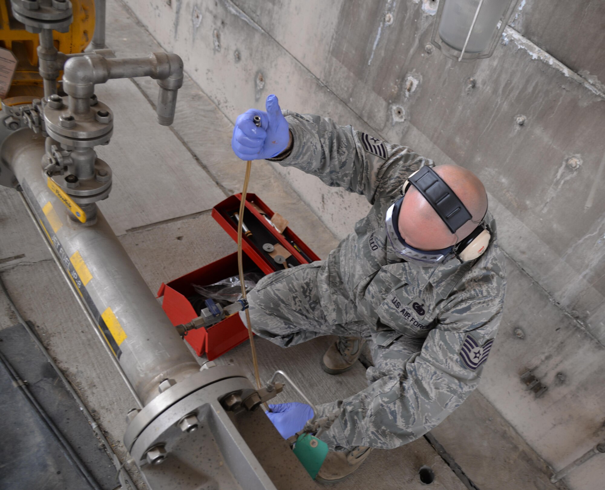 Tech. Sgt. Jason Bello, 51st Logistics Readiness Squadron fuels laboratory NCO in charge, performs a real-world fuel test during readiness exercise Beverly Midnight 16-01 March 8, 2016, at Osan Air Base, Republic of Korea. Throughout the exercise many Airmen from across base are meeting both real-world and exercise mission requirements in order to maintain fight tonight readiness. (U.S. Air Force photo by Staff Sgt. Benjamin Sutton/Released) 