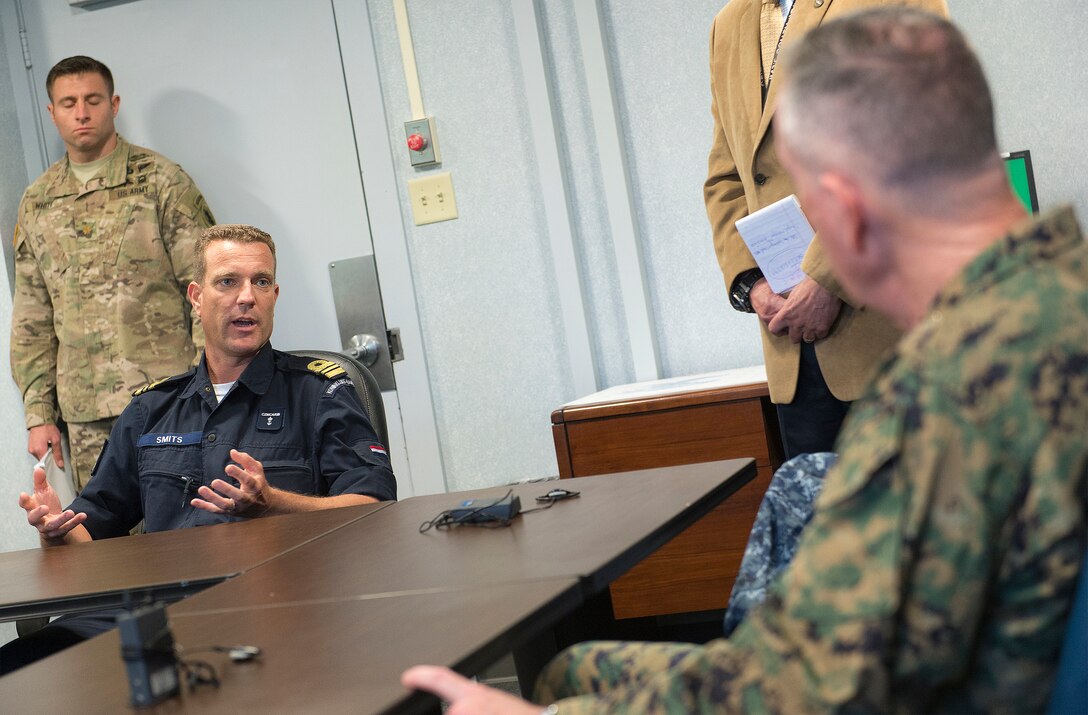 Marine Corps Gen. Joseph F. Dunford Jr., right, chairman of the Joint Chiefs of Staff, meets with liaison officers from partner nations while visiting Joint Interagency Task Force South in Key West, Fla., March 8, 2016. DoD photo by Navy Petty Officer 2nd Class Dominique A. Pineiro