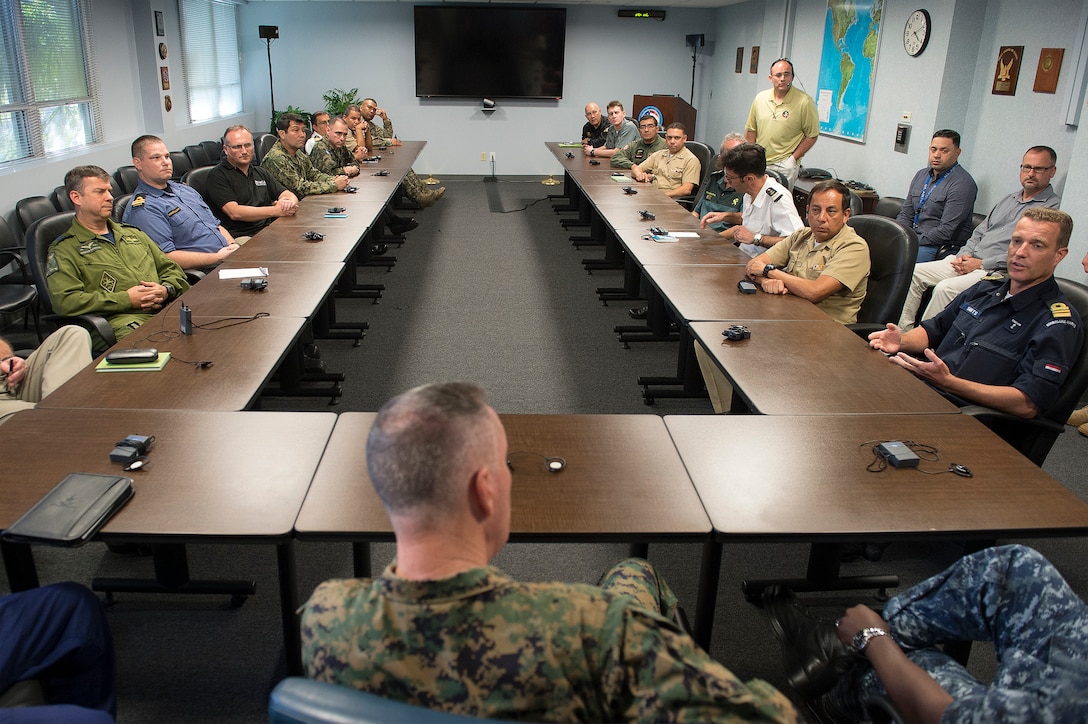Marine Corps Gen. Joseph F. Dunford Jr., chairman of the Joint Chiefs of Staff, talks with liaison officers from partner nations while visiting Joint Interagency Task Force South in Key West, Fla., March 8, 2016. DoD photo by Navy Petty Officer 2nd Class Dominique A. Pineiro