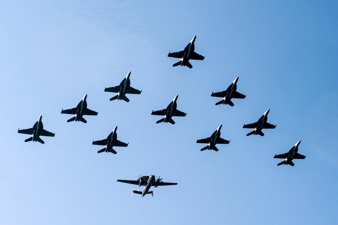 Aircraft assigned to Carrier Air Wing 9 fly in formation during an airpower demonstration over the aircraft carrier USS John C. Stennis in the Philippine Sea, March 7, 2016. The Stennis is providing a ready force supporting security and stability in the Indo-Asia-Pacific. Stennis is operating as part of the Great Green Fleet on a regularly scheduled 7th Fleet deployment. Navy photo by Petty Officer 2nd Class Jonathan Jiang