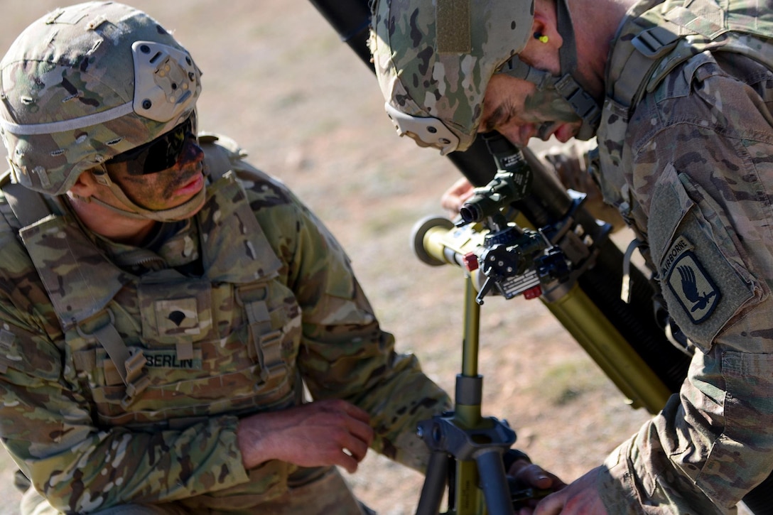 Army Pfc. Benjamin Mills, right, checks the sight on an M252 81 mm mortar during Exercise Sky Soldier 16 on Chinchilla training area in Albacete, Spain, March 4, 2016. Mills is a mortarman assigned to the 1st Battalion, 503rd Infantry Regiment, 173rd Airborne Brigade. Army photo by Staff Sgt. Opal Vaughn