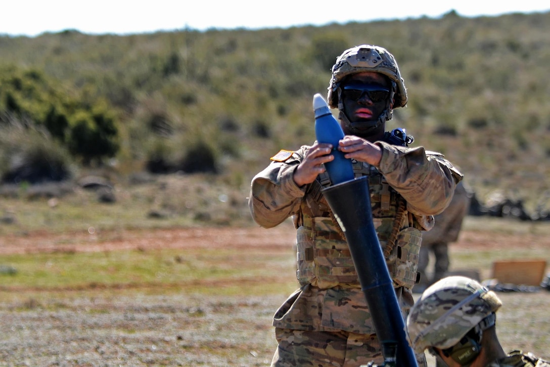 Army Pfc. Isaac Bautista loads an M252 81 mm mortar during Exercise Sky Soldier 16 on Chinchilla training area in Albacete, Spain, March 4, 2016. Bautista is a mortarman assigned to the 1st Battalion, 503rd Infantry Regiment, 173rd Airborne Brigade. Army photo by Staff Sgt. Opal Vaughn