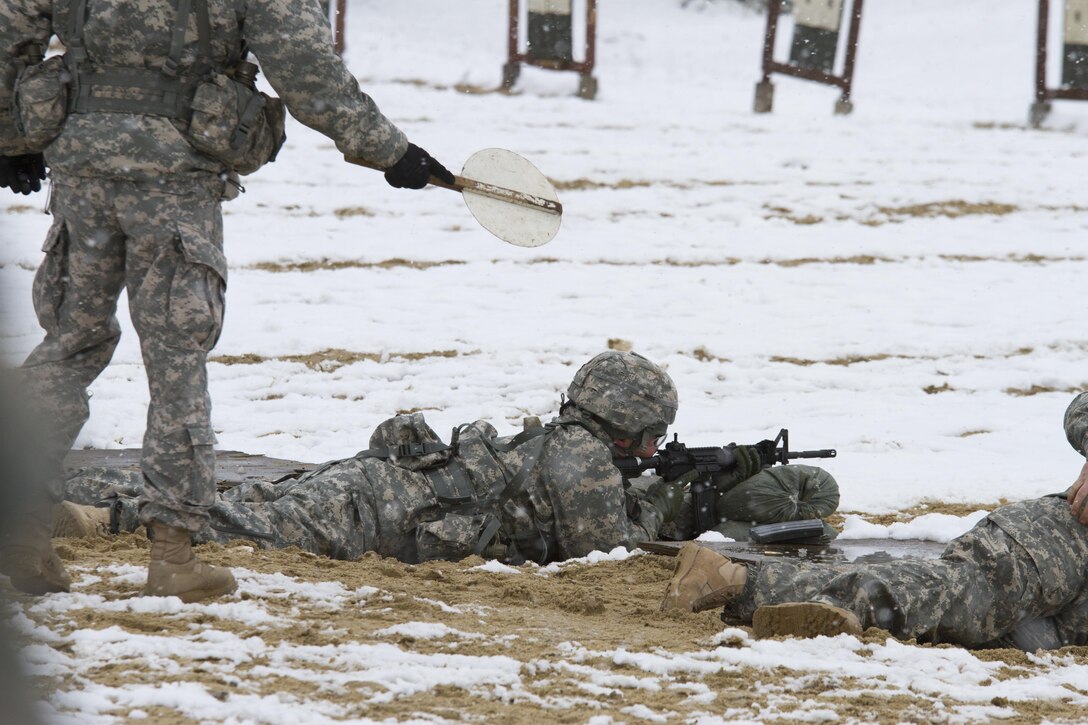 A U.S. Army Reserve range cadre gives instruction to a soldier within the 200th Military Police Command during a weapons qualification range at Joint Base McGuire-Dix-Lakehurst March 4. (U.S. Army photo by Sgt. Jennifer Spiker)