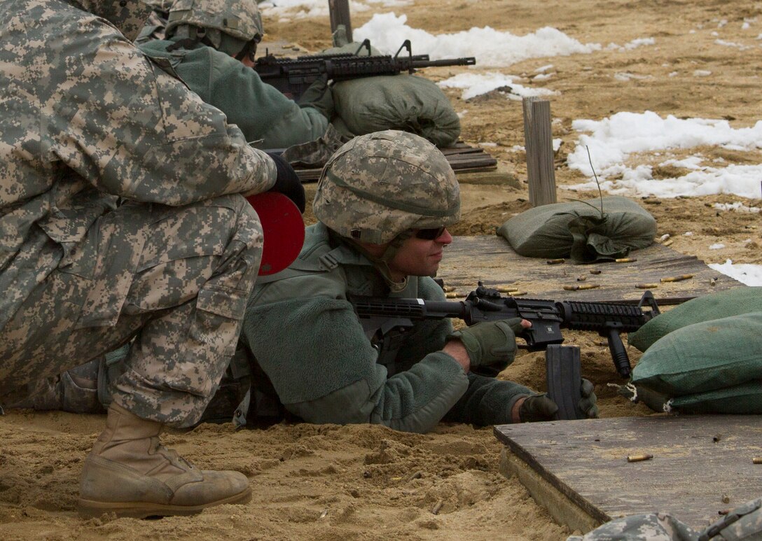 A U.S. Army Reserve range cadre gives instruction to a soldier within the 200th Military Police Command during a weapons qualification range at Joint Base McGuire-Dix-Lakehurst March 4. (U.S. Army photo by Sgt. Jennifer Spiker)