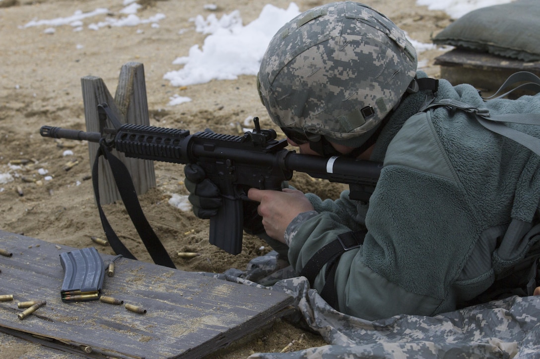 A U.S. Army Reserve Soldier within the 200th Military Police Command fires his assigned weapon during a qualification range at Joint Base McGuire-Dix-Lakehurst March 4. (U.S. Army photo by Sgt. Jennifer Spiker)