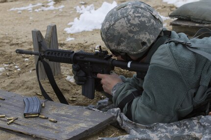 A U.S. Army Reserve Soldier within the 200th Military Police Command fires his assigned weapon during a qualification range at Joint Base McGuire-Dix-Lakehurst March 4. (U.S. Army photo by Sgt. Jennifer Spiker)