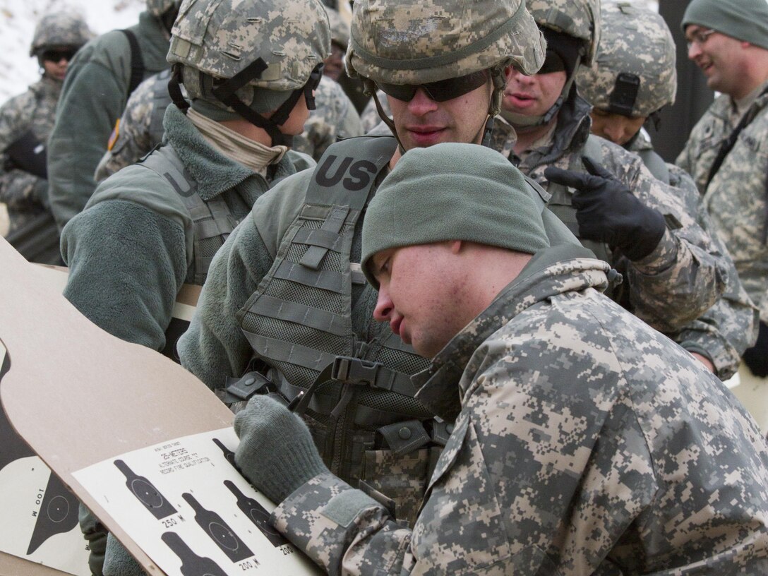 A U.S. Army Reserve range cadre within the 200th Military Police Command scores a target during a qualification range at Joint Base McGuire-Dix-Lakehurst March 4. (U.S. Army photo by Sgt. Jennifer Spiker)