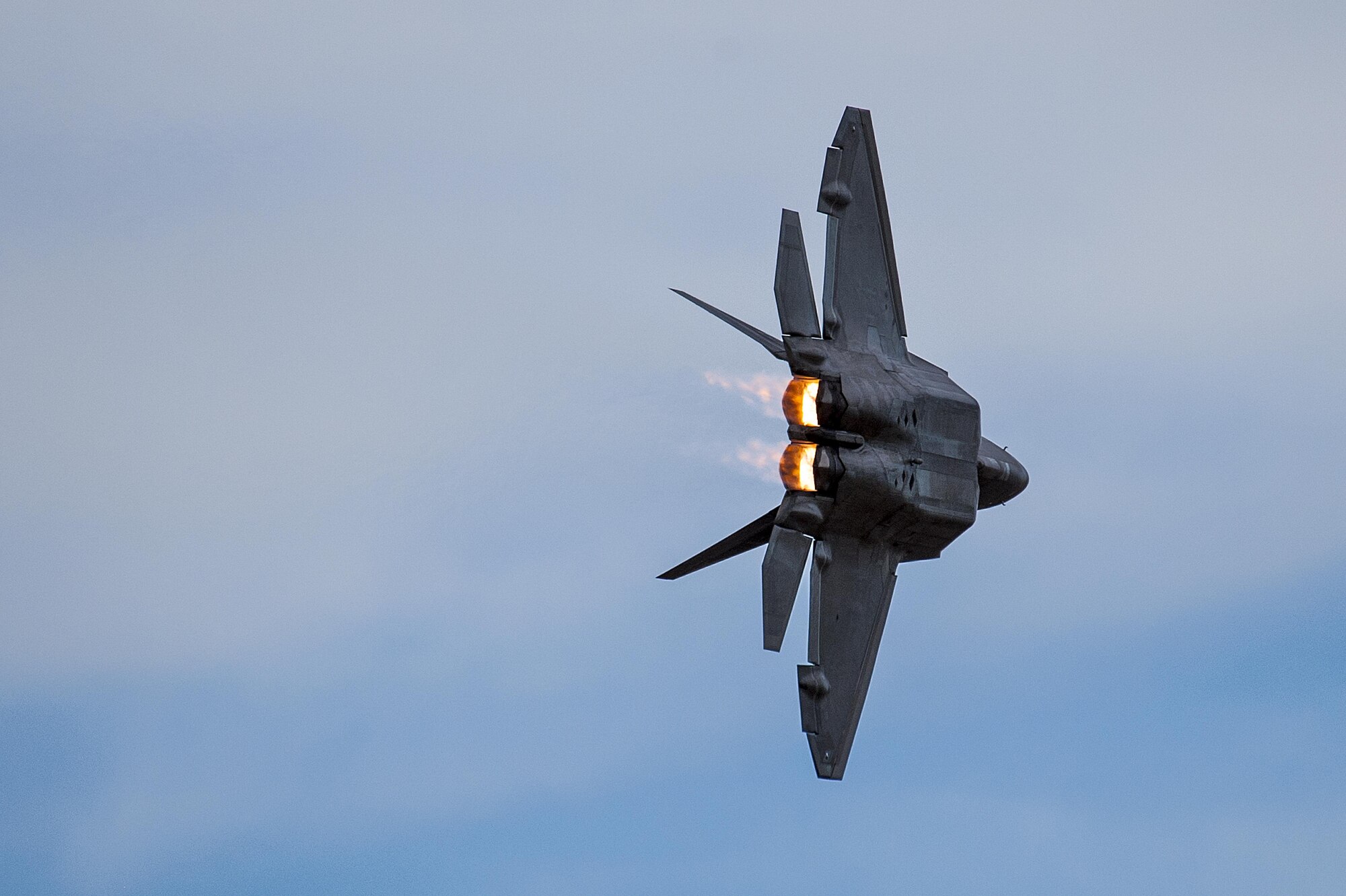 A U.S. Air Force F-22 Raptor performs a left bank during the 2016 Heritage Flight Training and Certification Course at Davis-Monthan Air Force Base, Ariz., March 5, 2016. The Raptor performs both air-to-air and air-to-ground missions allowing full realization of operational concepts vital to the 21st century Air Force. (U.S. Air Force photo by Senior Airman Chris Drzazgowski/Released)