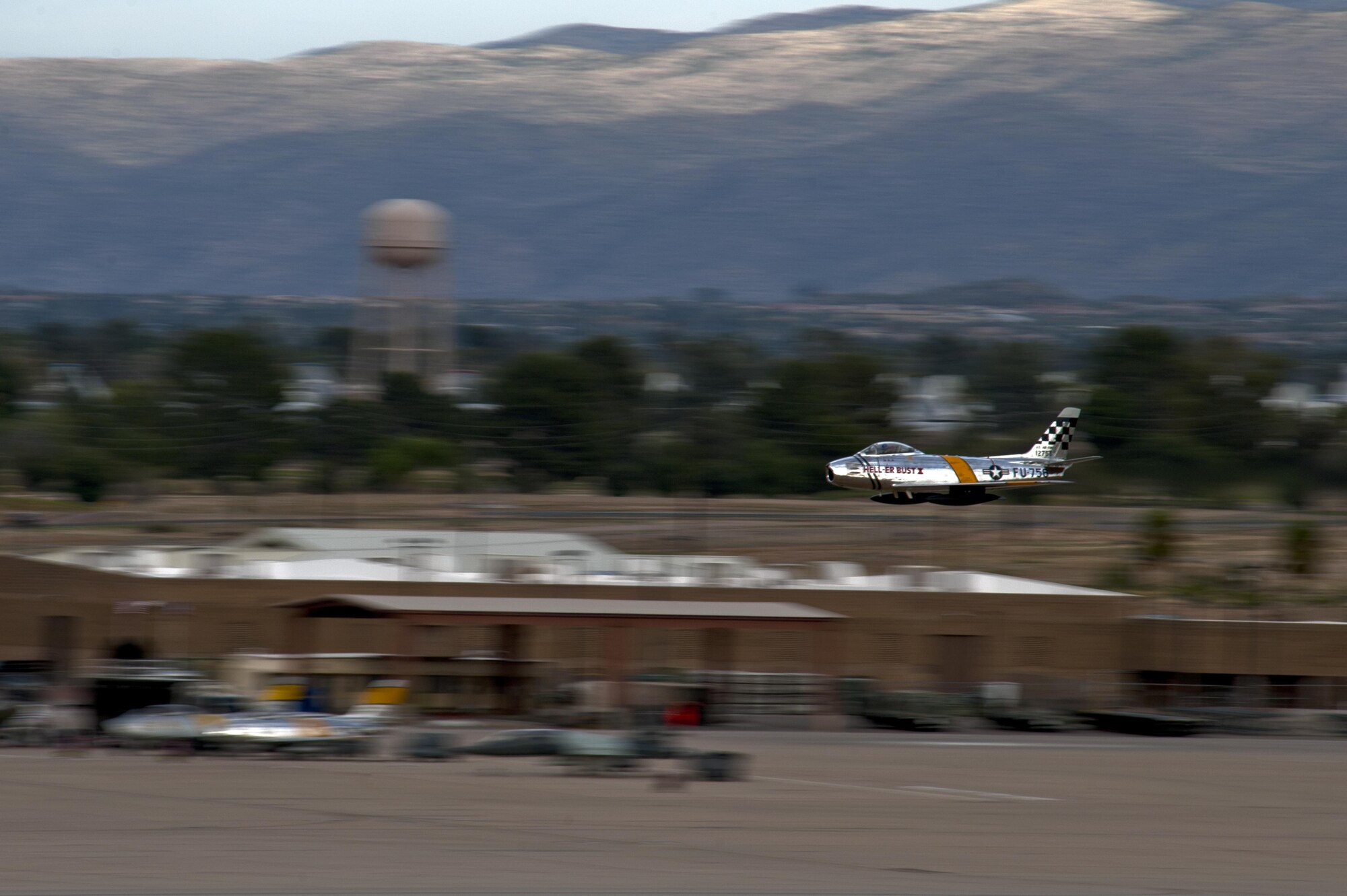 An F-86 Sabre performs a high-speed pass during the 2016 Heritage Flight Training and Certification Course at Davis-Monthan Air Force Base, Ariz., March 5, 2016. The first production model of the F-86 flew in 1948 and supported the Strategic Air Command from 1949 to 1950. (U.S. Air Force photo by Senior Airman Chris Drzazgowski/Released)
