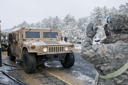 A Humvee moves into position to be fueled by the 957th Quartermaster Company (Petroleum Supply) during Combat Support Training Exercise 78-16-01 at Joint Base McGuire-Dix-Lakehurst, N.J., March 4, 2016. CSTX 78-16-01 is a U.S. Army Reserve exercise conducted at multiple locations across the country designed to challenge combat support units and Soldiers to improve and sustain skills necessary during a deployment.  (U.S. Army photo by Staff Sgt. Dalton Smith/Released)