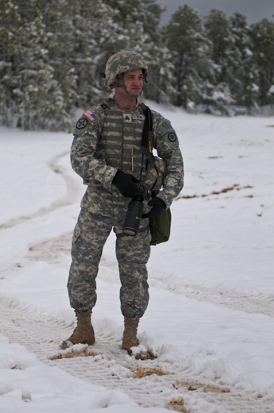 Sgt. Christopher Bigelow; a public affairs noncommissioned officer, with the 316th Sustainment Command (Expeditionary), searches for the perfect moment to photograph Soldiers during Combat Support Training Exercise 78-16-01 at Joint Base McGuire-Dix-Lakehurst, N.J., March 04, 2016. CSTX 78-16-01 is a U.S. Army Reserve exercise conducted at multiple locations across the country designed to challenge combat support units and Soldiers to improve and sustain skills necessary during a deployment. (U.S. Army photo by Staff Sgt. Dalton Smith/Released)