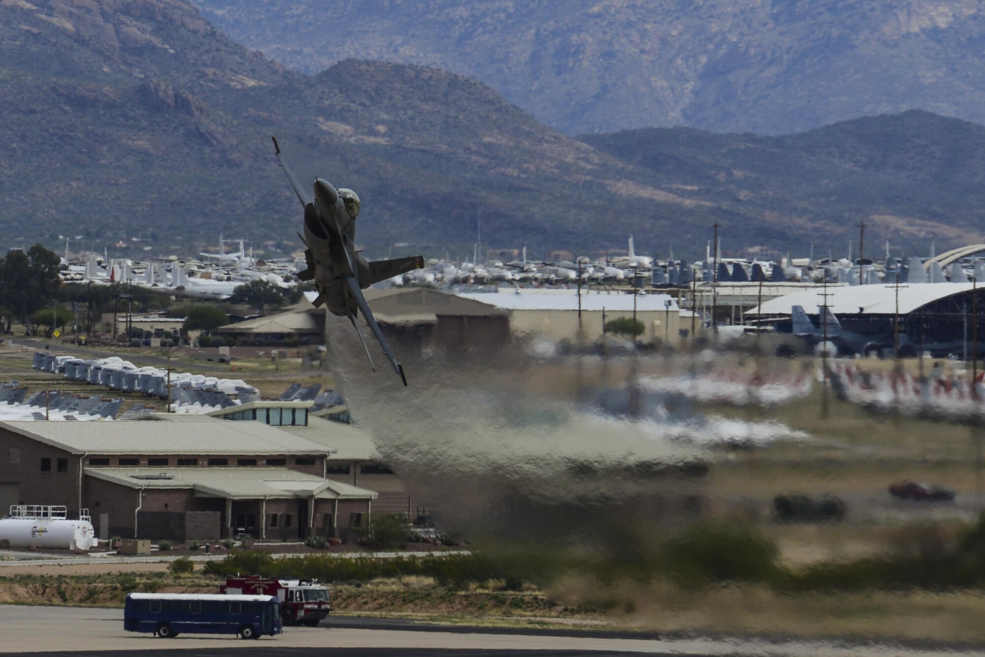 An F-16CM Fighting Falcon performs a high-angle bank during the 2016 Heritage Flight Training and Certification Course at Davis-Monthan Air Force Base, Ariz., March 6, 2016. It provides a relatively low-cost, high performance weapon system for the United States and its allied nations. (U.S. Air Force photo by Senior Airman Chris Drzazgowski/Released)