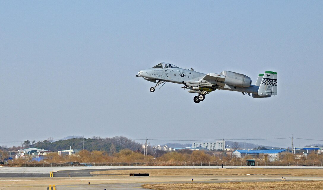 An A-10 Thunderbolt II takes off at Osan Air Base, Republic of Korea, March 9, 2016, during exercise Beverly Midnight 16-01 at Osan Air Base, Republic of Korea, March 9, 2016. This was the first A-10 to take off during BM 16-01, an exercise designed to test the warfighting capabilities of the units assigned to the 51st Fighter Wing with a focus on readiness, defending the base and executing flying operations.   (U.S. Air Force photo by Tech. Sgt. Travis Edwards/Released)