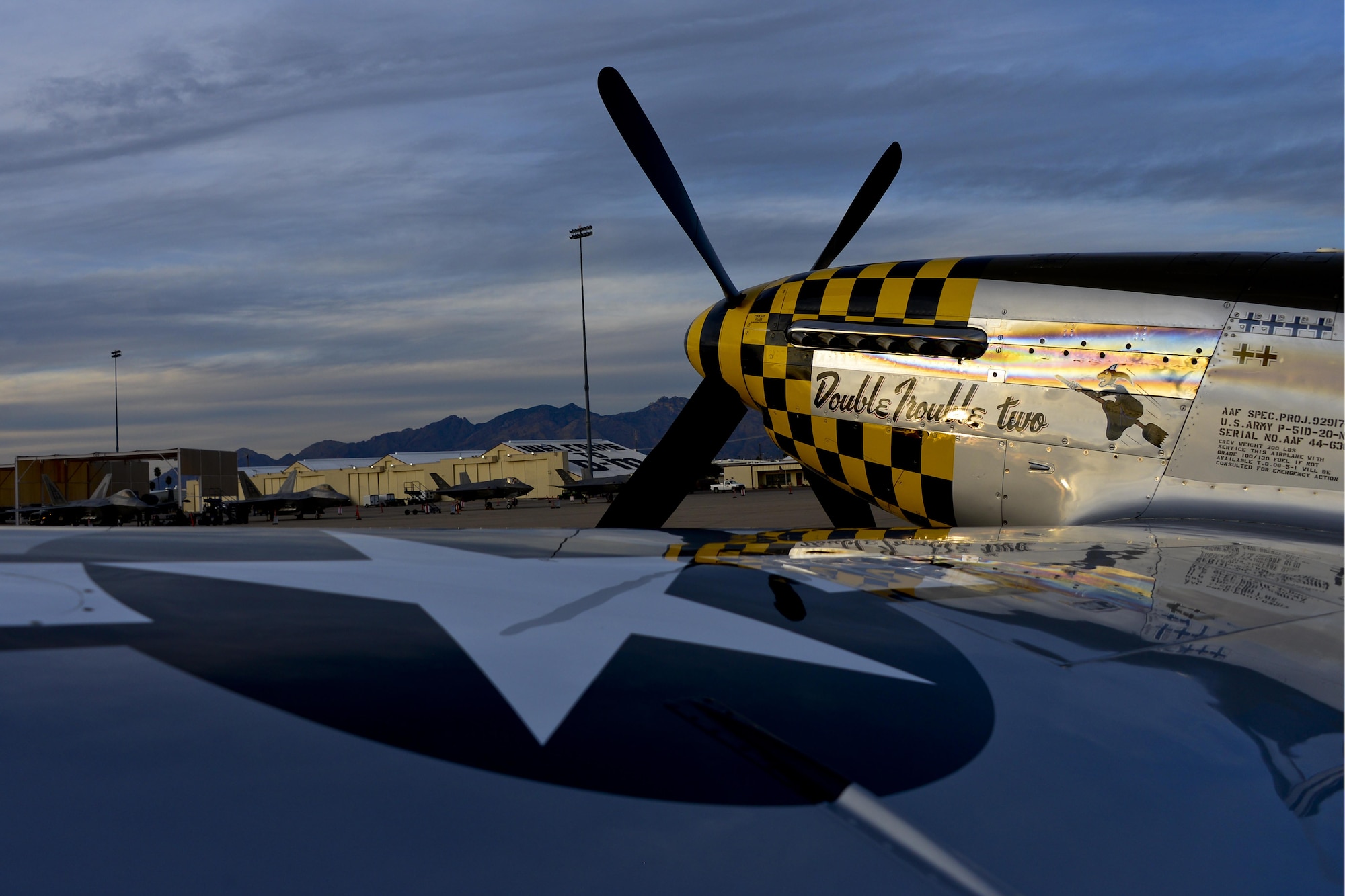 The P-51 Mustang “Double Trouble two” sits on the flightline after the first day of the 2016 Heritage Flight Training and Certification Course at Davis-Monthan Air Force Base, Ariz., March 4, 2016. During the course, aircrews practice ground and flight training to enable civilian pilots of historic military aircraft and U.S. Air Force pilots of current fighter aircraft to fly safely in formations together. (U.S. Air Force photo by Senior Airman Chris Drzazgowski/Released)