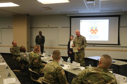 Maj. Gen. Leslie Carroll (right), the commanding general for the 377th Theater Sustainment Command presents a length of service certificate and emblem to Margaret “Peggy” Ranschaert in honor of her 45-year career of service as an Army civilian employee  during a length of service ceremony held March 4 at the Spc. Luke P. Frist Army Reserve Center at Fort Benjamin Harrison, Ind.