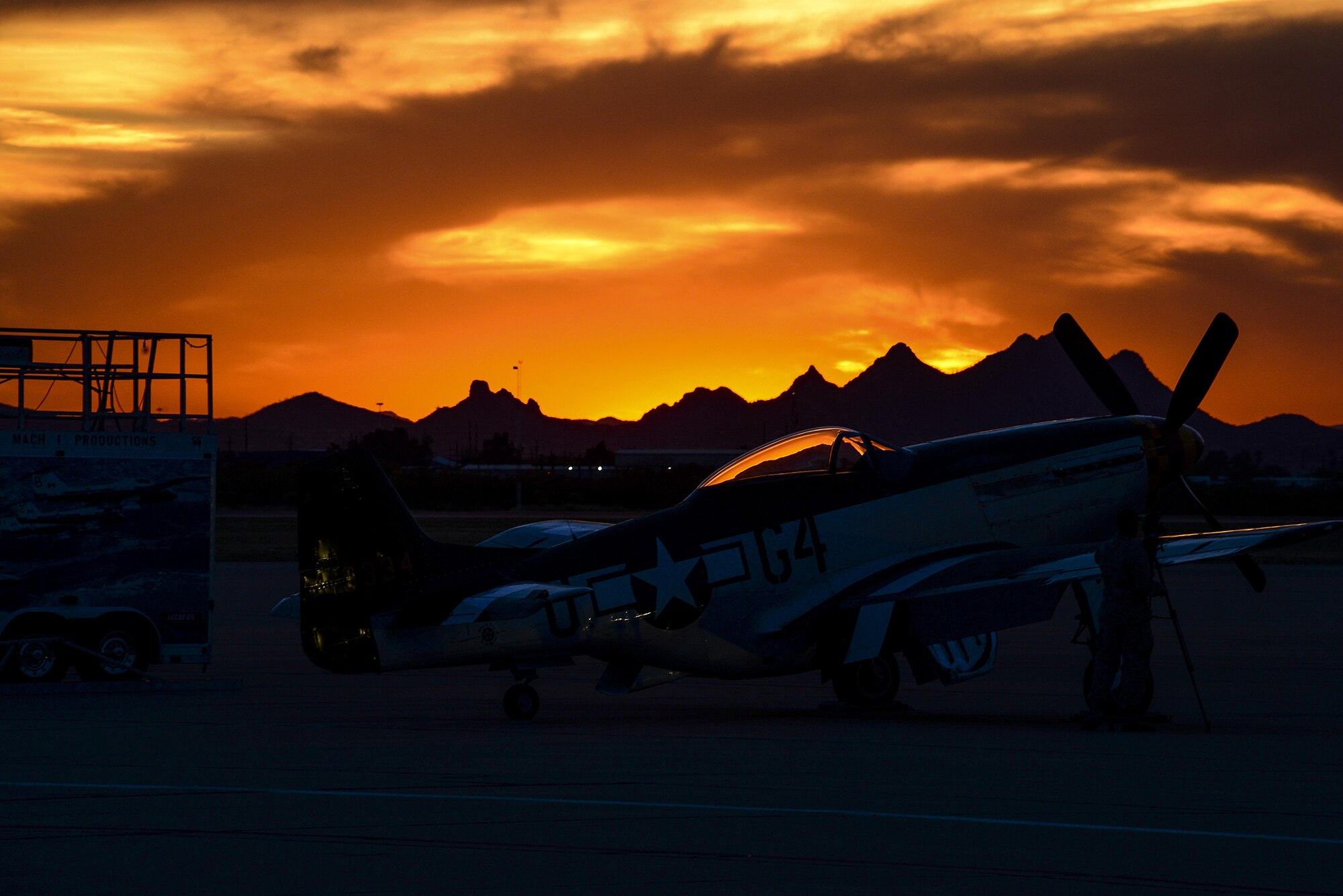 A P-51 Mustang sits on the flightline during a sunset after the first day of the 2016 Heritage Flight Training and Certification Course at Davis-Monthan Air Force Base, Ariz., March 4, 2016. Other historic aircraft that participated in this year’s HFTCC included the P-40 Warhawk, the P-38 Lightning, the P-47 Thunderbolt and the F-86 Sabre. (U.S. Air Force photo by Senior Airman Chris Drzazgowski/Released)