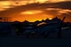 A P-51 Mustang sits on the flightline during a sunset after the first day of the 2016 Heritage Flight Training and Certification Course at Davis-Monthan Air Force Base, Ariz., March 4, 2016. Other historic aircraft that participated in this year’s HFTCC included the P-40 Warhawk, the P-38 Lightning, the P-47 Thunderbolt and the F-86 Sabre. (U.S. Air Force photo by Senior Airman Chris Drzazgowski/Released)