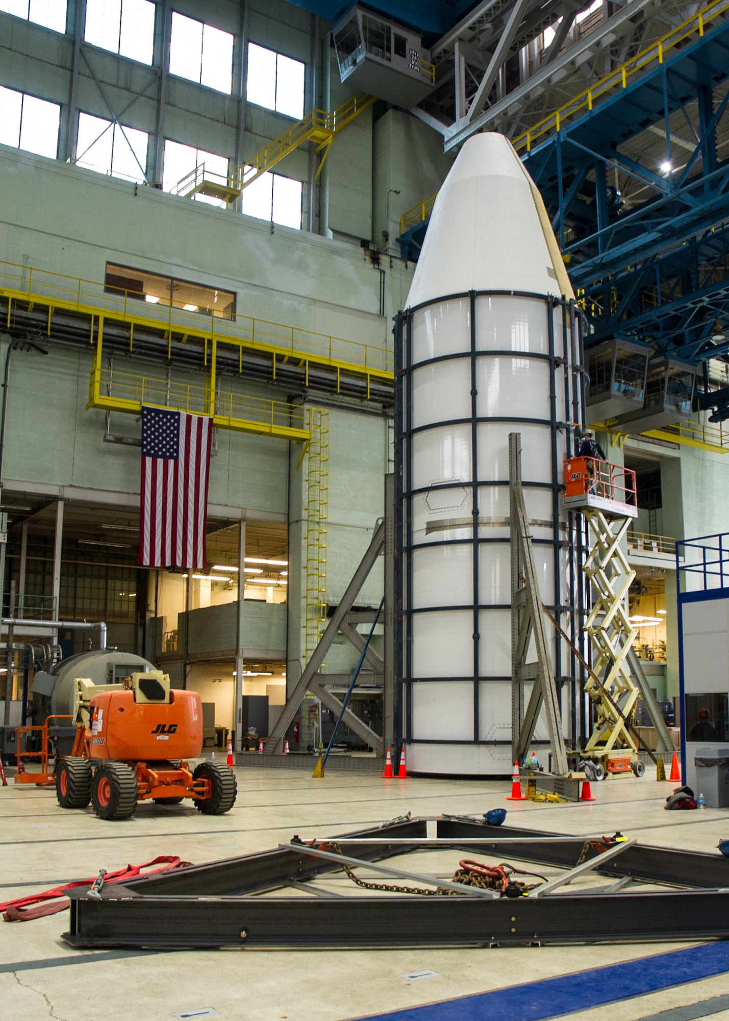 DAYTON, Ohio - Air Force Research Laboratory engineers and technicians from the Structural Validation Branch of the Aerospace Vehicles Division, Aerospace Systems Directorate, partnered with museum restoration crews to assemble a 60 foot tall payload fairing from the Titan IVB space launch vehicle between  Feb. 29-March 2, 2016. The impressive Titan IVB, with roots going back to the early days of U.S. Air Force and civil space launch, is significant as the museum looks to share the story of USAF and USAF-enabled space operations in its Space Gallery. The Titan IVB will be on display in the new fourth building at the National Museum of the U.S. Air Force which opens to the public on June 8. (U.S. Air Force photo by Ken LaRock)