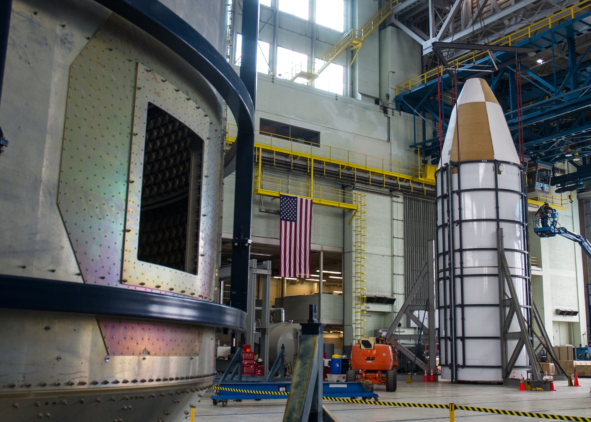 DAYTON, Ohio - Air Force Research Laboratory engineers and technicians from the Structural Validation Branch of the Aerospace Vehicles Division, Aerospace Systems Directorate, partnered with museum restoration crews to assemble a 60 foot tall payload fairing from the Titan IVB space launch vehicle between  Feb. 29-March 2, 2016. The impressive Titan IVB, with roots going back to the early days of U.S. Air Force and civil space launch, is significant as the museum looks to share the story of USAF and USAF-enabled space operations in its Space Gallery. The Titan IVB will be on display in the new fourth building at the National Museum of the U.S. Air Force which opens to the public on June 8. (U.S. Air Force photo by Ken LaRock)