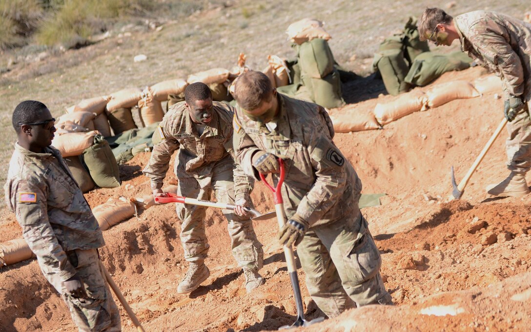 Army paratroopers dig a hole for a mortar during Exercise Sky Soldier 16 on Chinchilla training area in Albacete, Spain, March 4, 2016. Army photo by Staff Sgt. Opal Vaughn
