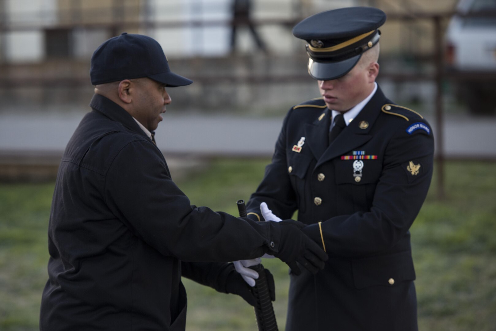 Staff Sgt. Edward Montgomery, Joint Base San Antonio-Fort Sam Houston Caisson Section military honors platoon sergeant, instructs Specialist Grant Meyer, 470th Military Intelligence Brigade human resource specialist and JBSA-Fort Sam Houston Honor guard member, Feb. 5 at JBSA-Fort Sam Houston. After 10 days of training in drill and ceremony, new members of the JBSA-Fort Sam Houston Honor Guard are ready to perform honors at military funerals.