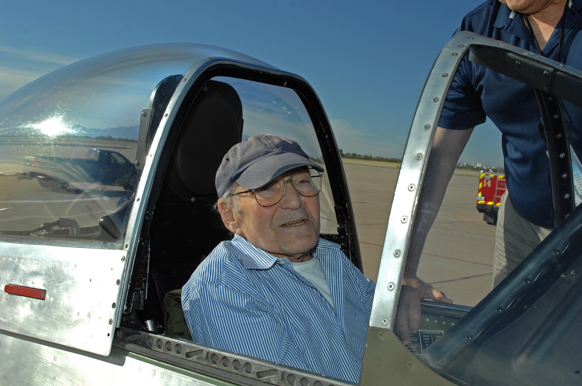 U.S. Air Force retired 1st Lt. William Lyons sits in the cock-pit of a P-51 Mustang during 2016 Heritage Flight Training and Certification Course at Davis-Monthan Air Force, Ariz., March 5, 2016. Lyons was a pilot who flew P-51 Mustangs during World War II with two confirmed kills. Lyons is visiting D-M and HFTCC as part of the 355th Fighter Group Association three-day tour. (U.S. Air Force photo by Senior Airman Camilla Elizeu/Released)