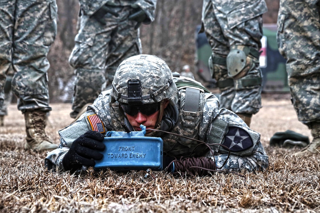 Army Spc. Konrad Przystupa shows Korean soldiers how to set up an M18A1 Claymore mine at California Range, South Korea, March 2, 2016. Przystupa is assigned to Company B, 2nd Battalion, 3rd Infantry Regiment, 2nd Stryker Brigade Combat Team. Army photo by Pfc. Elliott Page