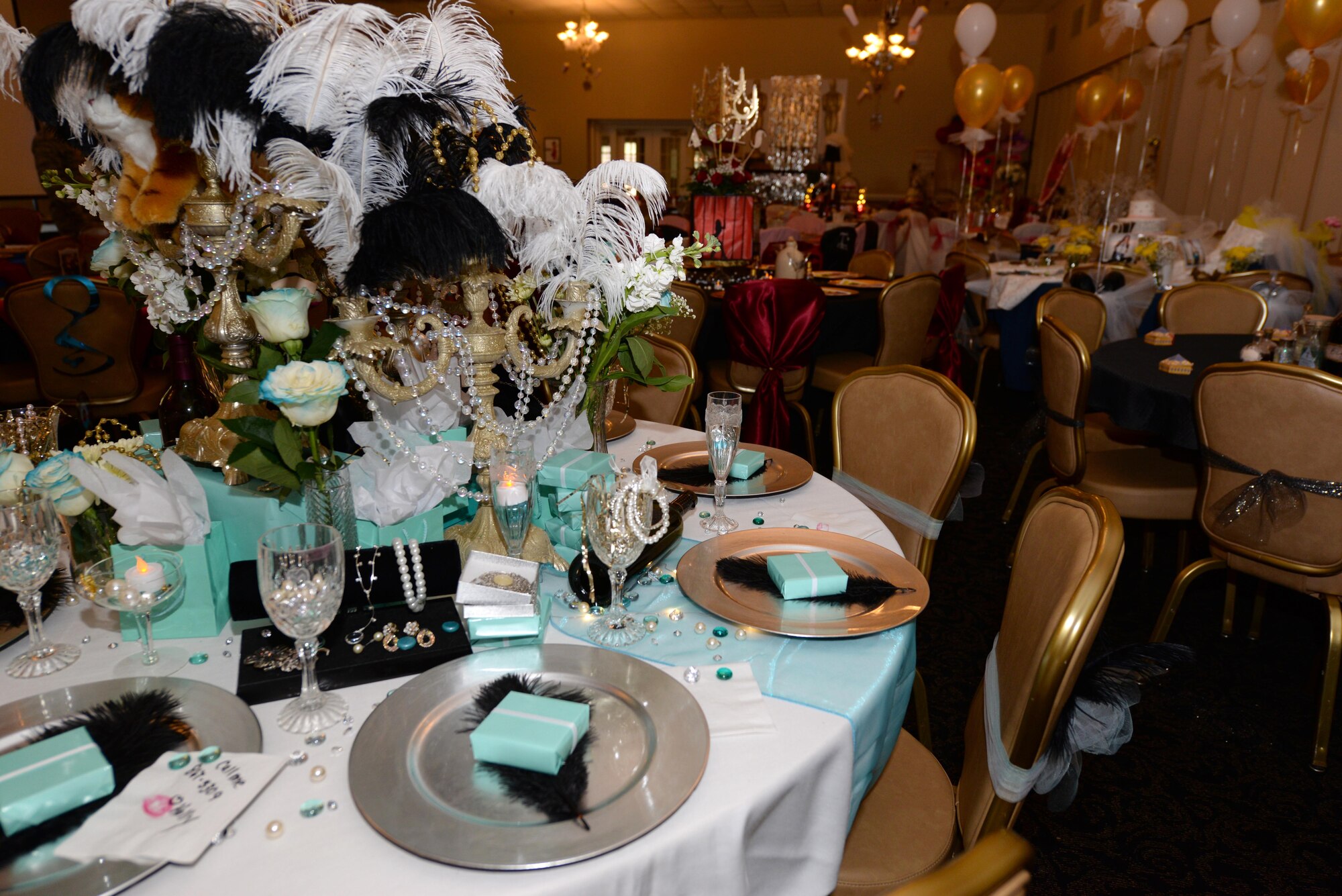 Spouses decorated a total of 14 tables to be judged for the first-ever Spouses Dining-in, March 5, 2016, at Seymour Johnson Air Force Base, North Carolina. Some of the themes were “Breakfast at Tiffany’s,” “The Great Gatsby,” “Alice in Wonderland” and “Snow White.” (U.S. photo/Airman 1st Class Ashley Williamson)