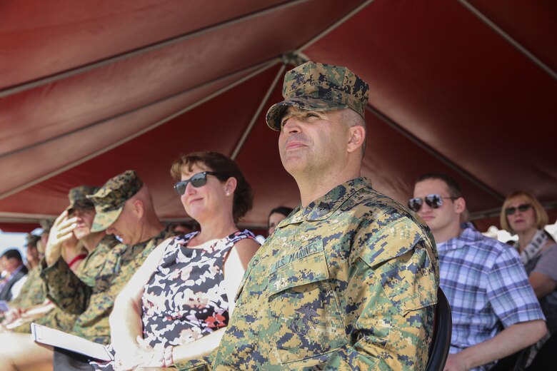 Sgt. Maj. Richard Charron, former sergeant major of Marine Corps Air Station Miramar, listens to remarks during his relief and appointment ceremony aboard MCAS Miramar, Calif., March 2. Charron relinquished his duties to Sgt. Maj. Michael Walton, former sergeant major of Marine Fighter Attack Squadron (VMFA) 232. (U.S. Marine Corps photo by Cpl. Alissa Schuning/Released)