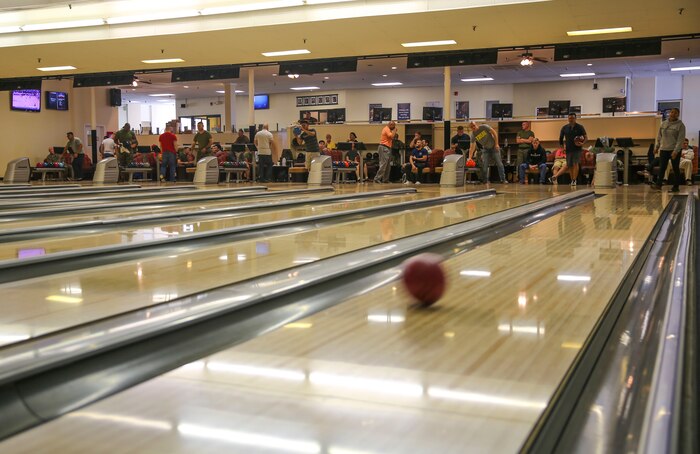 Participants in the Commanding General’s Cup Scratch Bowling Tournament compete against each other at the recreation center on Marine Corps Recruit Depot San Diego, March 8. Each participant played three games, and their scores were added up to see who achieved the highest scores at the end of the tournament.