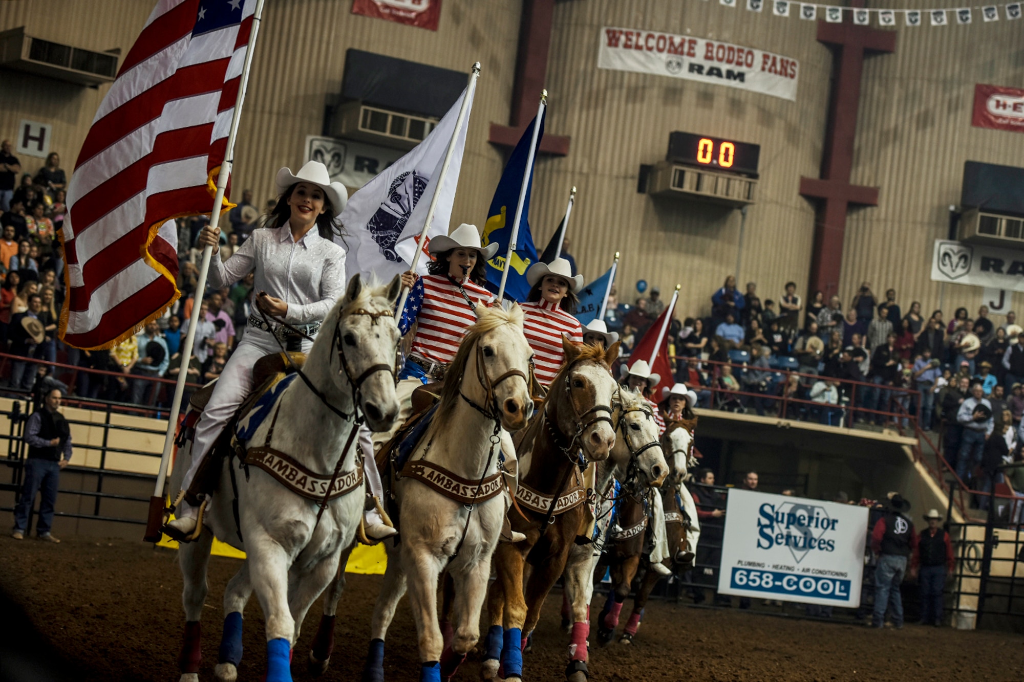 Paige Allison, San Angelo Stock Show and Rodeo Ambassador co-captain, carries the American flag as the Ambassadors perform their routine during the 84th annual San Angelo Stock Show and Rodeo at Foster Communications Coliseum in San Angelo, Texas, Feb. 17, 2016. The Ambassadors carried each of the armed services’ flags as well as the POW/MIA flag to honor service members as part of Military Appreciation Night. (U.S. Air Force photo by Senior Airman Devin Boyer/Released)