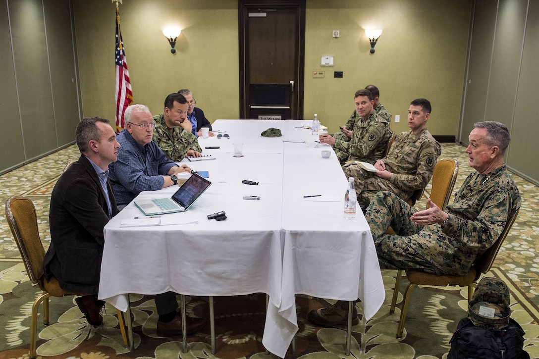 Marine Corps Gen. Joseph F. Dunford Jr., chairman of the Joint Chiefs of Staff, right, meets with reporters in Key West, Fla., March, 8, 2016, during a trip to the U.S. Southern Command area of responsibility. DoD photo by Navy Petty Officer 2nd Class Dominique A. Pineiro