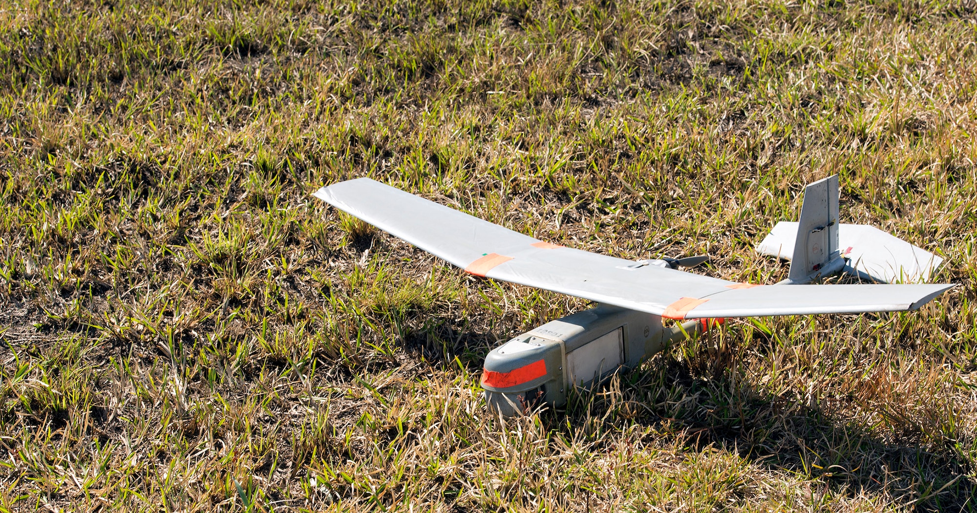 An RQ-11 B Raven small unmanned aircraft system rests on the ground prior to a mission capabilities demonstration, March 3, 2016, at Moody Air Force Base, Ga. The 820th Base Defense Group utilizes the aircraft to perform intelligence, surveillance and reconnaissance over dangerous areas in real-world operations. (U.S. Air Force photo by Airman 1st Class Greg Nash/Released) 