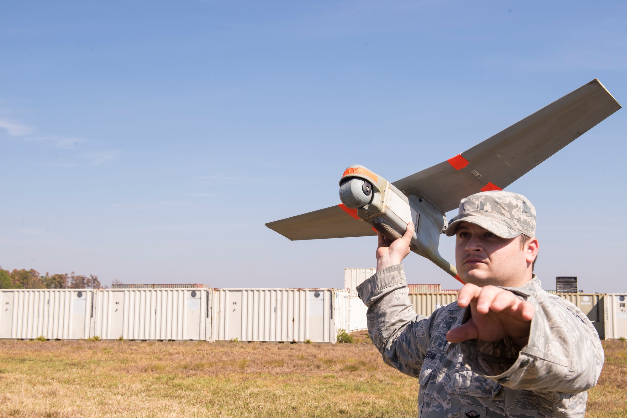 U.S. Air Force Staff Sgt. James Beauchamp, 823d Base Defense Squadron RQ-11 B Raven small unmanned aircraft system operator, launches a Raven during a mission capabilities demonstration, March 3, 2016, at Moody Air Force Base, Ga. The Raven can reach altitudes up to 10,000 kilometers and has the capability to be flown manually or navigate a preplanned route autonomously. (U.S. Air Force photo by Airman 1st Class Greg Nash/Released)