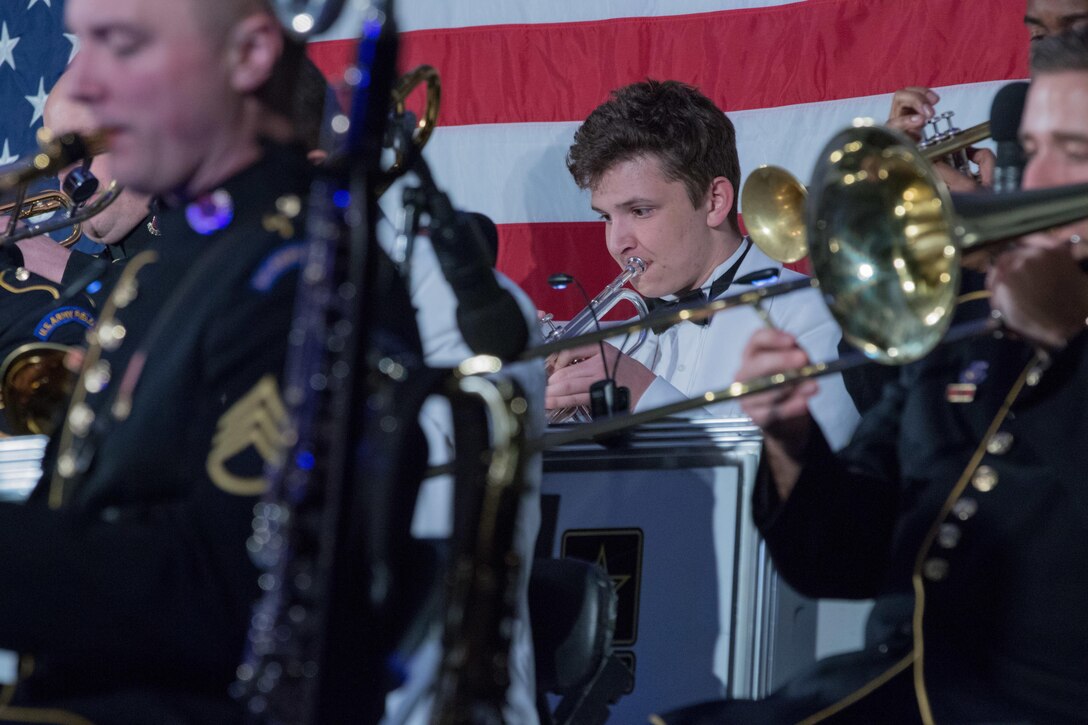 Palm Springs High School student, Emerson Noble, plays a Perspectives educational arrangement on his trumpet alongside The Jazz Ambassadors concert March 9, in Palm Springs, Calif. The Jazz Ambassadors is the U.S. Army’s official touring big band and are currently traveling the western U.S. on their spring concert tour. (U.S. Army photo by Sgt. 1st Class Joshua Johnson)