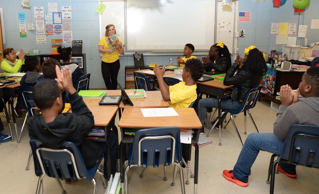 Sgt. Hannah Srebernak, supply noncommissioned officer, Storage Operations Division, Marine Corps Logistics Command, reads to 5th-grade students at International Studies Charter School, Albany, Ga., as a part of the Read Across America activities. The national event is held annually to celebrate the recent birthday of author, illustrator Theodor Seuss Geisel, better known as Dr. Seuss.

