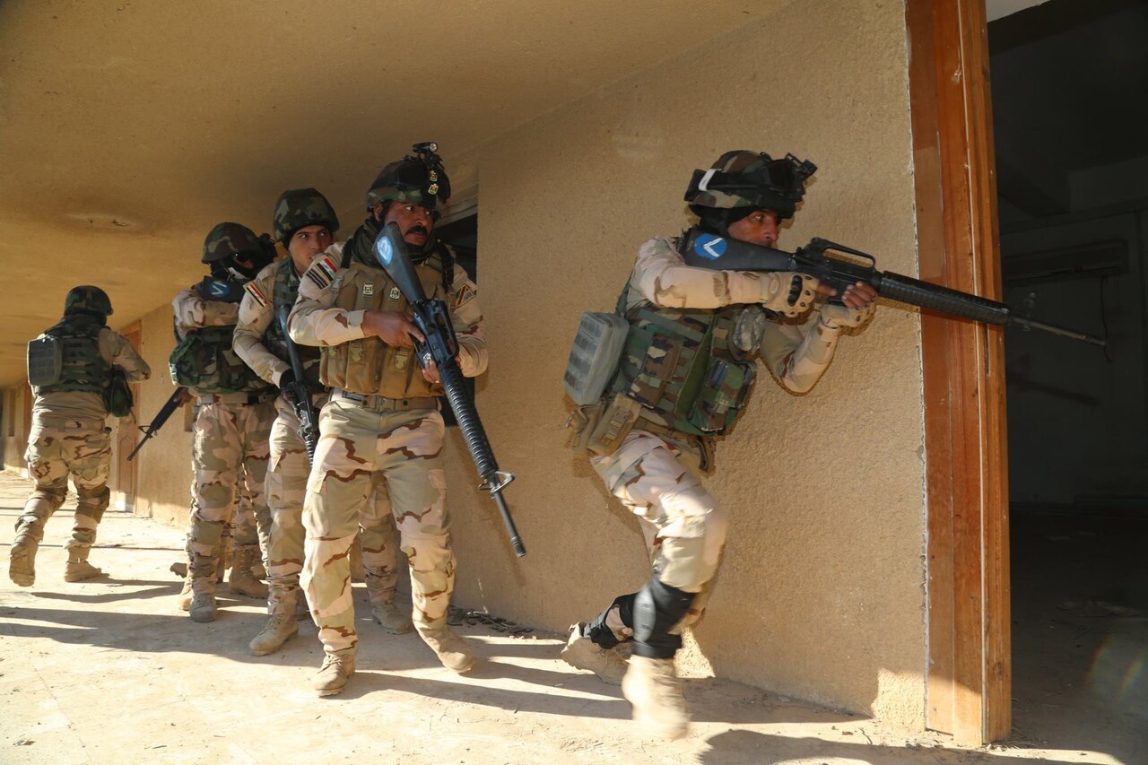 Iraqi soldiers from 2nd Battalion, 71st Brigade, enter a room after breaching the doorway to ensure that it is clear at Camp Taji, Iraq, Jan. 10, 2016. Task Group Taji provides company-level urban operations training to teach Iraqis how to move and communicate in an urban environment. Training at the building partner capacity sites is an integral part of Combined Joint Task Force – Operation Inherent Resolve’s multinational effort to train Iraqi security force personnel to defeat the Islamic State of Iraq and the Levant. Army photo by Sgt. Kalie Jones