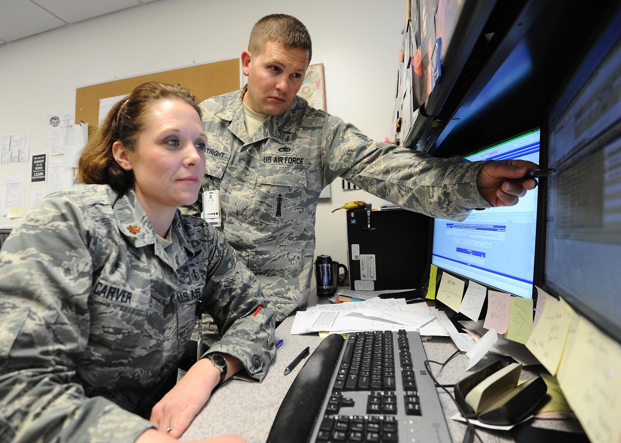 Major Lori Carver, 325th Medical Operations Squadron family nurse practitioner and Staff Sgt. Wallace Boatright, 325th MDOS talon team NCO in-charge, review patient records March 3 at the 325th Medical Group. Medical records are reviewed prior to each patient's visit to ensure thorough, quality care is given. (U.S. Air Force photo by Senior Airman Ty-Rico Lea)