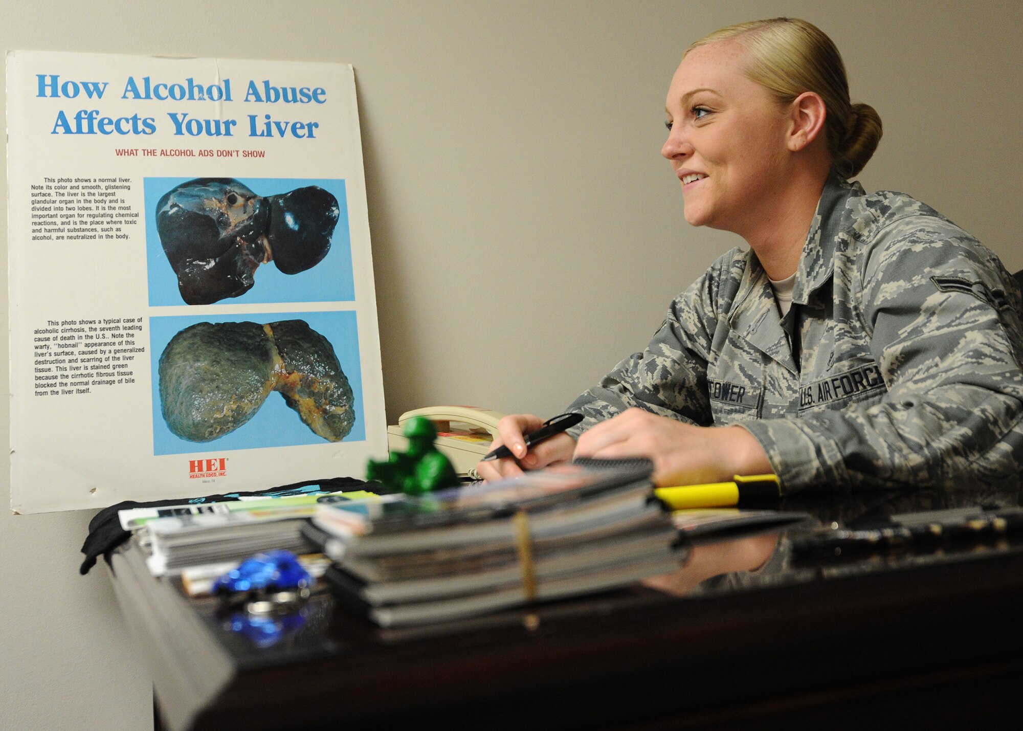 Airman 1st Class Katlin Hightower, 325th Medical Operations Squadron mental health technician, poses for a photo as she prepares for an upcoming Alcohol Drug Abuse Prevention Treatment outreach presentation March 8 at the Mental Health facility. Hightower spends her spare time working as a certified volunteer for American Red Cross. As a volunteer, she visits houses on weekends and installs fire alarms for those who may not be able to afford them. (U.S. Air Force photo by Senior Airman Ty-Rico Lea/Released)