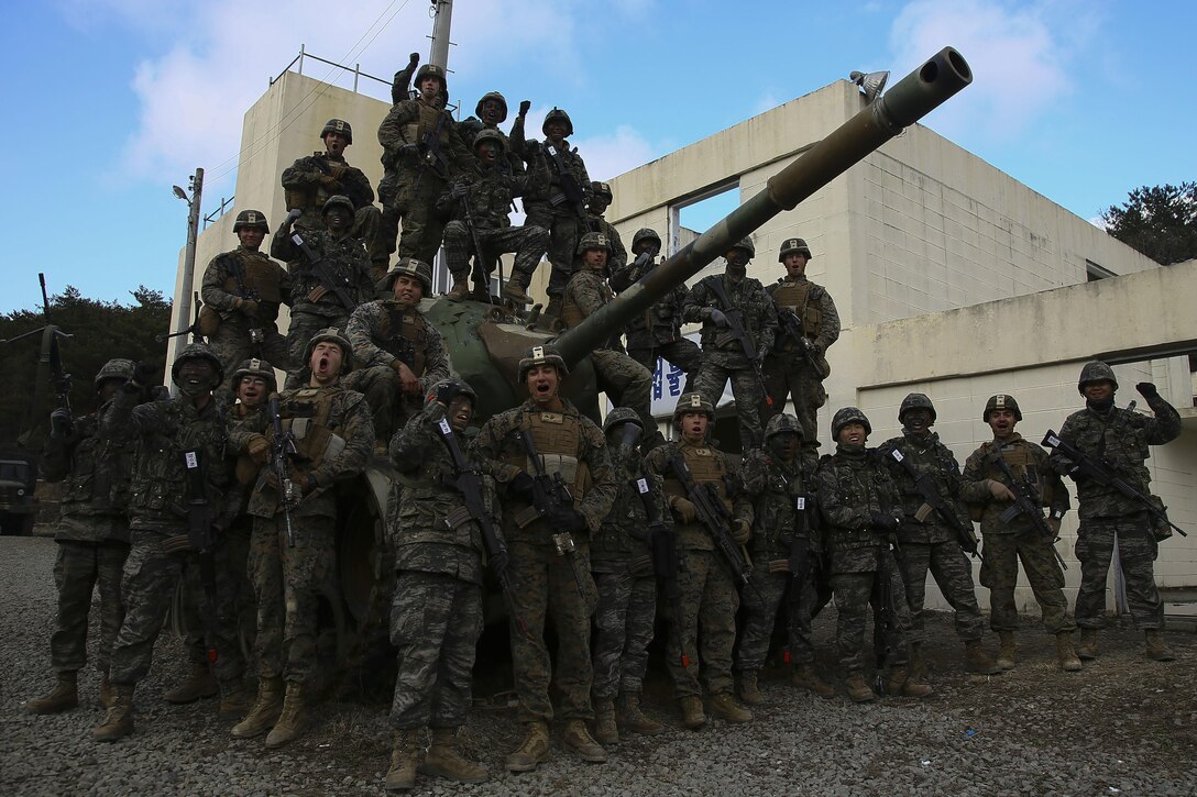 U.S. Marines pose for a group photo with Republic of Korea Marines after conducting integrated training during exercise Ssang Yong 16 in Pohang, South Korea, March 9, 2016. The Marines are mortarmen with Weapons Company, 1st Battalion, 3rd Marine Regiment,“The Lava Dogs”, currently assigned to 4th Marine Regiment on a unit deployment program to Okinawa Japan.  Exercise Ssang Yong 16 is a biennial military exercise focused on strengthening the amphibious landing capabilities of the Republic of Korea, the U.S., New Zealand and Australia. (U.S. Marine Corps photo by Cpl. Allison Lotz/Released)