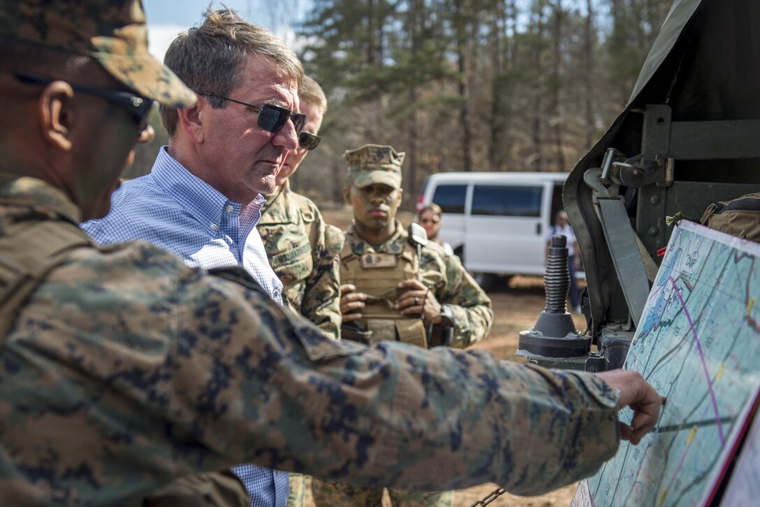 Defense Secretary Ash Carter receives a briefing before a platoon in a defense demonstration at The Basic School on Marine Corps Base Quantico, Va., March 9, 2016. DoD photo by Air Force Senior Master Sgt. Adrian Cadiz
