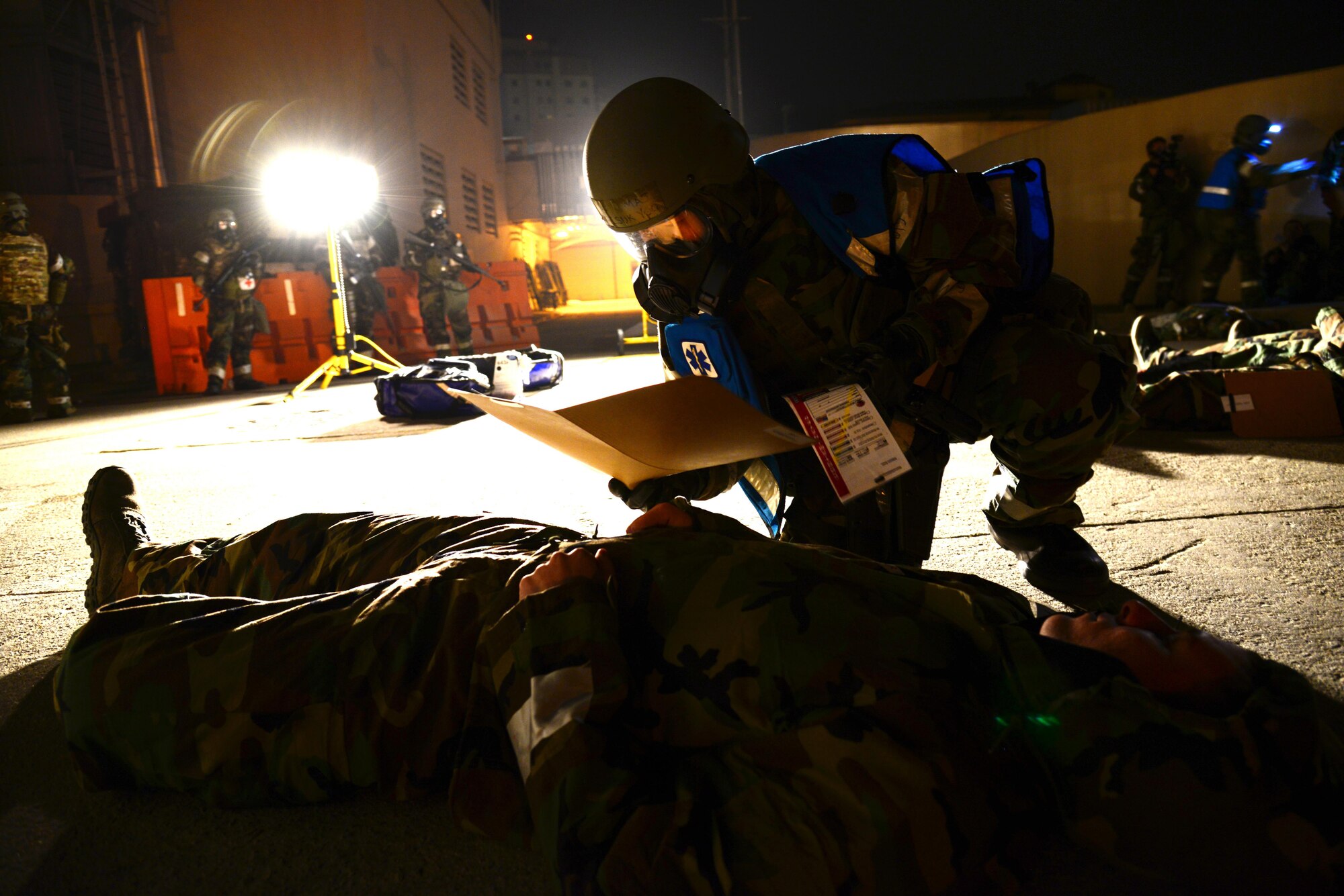 A 51st Medical Group triage officer determines a simulated victim’s injuries during exercise Beverly Midnight 16-01, Osan Air Base, Republic of Korea, March 8, 2016. Members of Team Osan are participating in the exercise in order to focus on readiness, test Osan’s wartime procedures, and realistically look at our ability to defend the base, execute operations and receive follow-on forces. (U.S. Air Force photo by Staff Sgt. Rachelle Coleman/Released)
