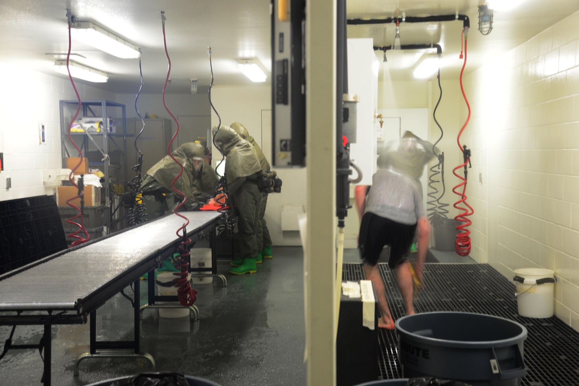 The 51st Medical Group patient decontamination team processes a simulated, immobile patient and an ambulatory patient simultaneously in the contamination control area during exercise Beverly Midnight 16-01, Osan Air Base, Republic of Korea, March 8, 2016. Patient decontamination teams are made up of medical personnel from various career fields. Members of Team Osan participate in the exercise in order to focus on readiness, test Osan’s wartime procedures, and realistically look at the wing’s ability to defend the base, execute operations and receive follow-on forces.  (U.S. Air Force photo by Staff Sgt. Rachelle Coleman/Released)