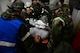 Medical personnel inside the clinic pull a simulated patient out of an air lock after being processed through the contamination control area during Exercise Beverly Midnight 16-01, Osan Air Base, Republic of Korea, March 8, 2016. Patients are transferred to the appropriate treatment area within the facility for further medical attention after being decontaminated. (U.S. Air Force photo by Staff Sgt. Rachelle Coleman/Released)
