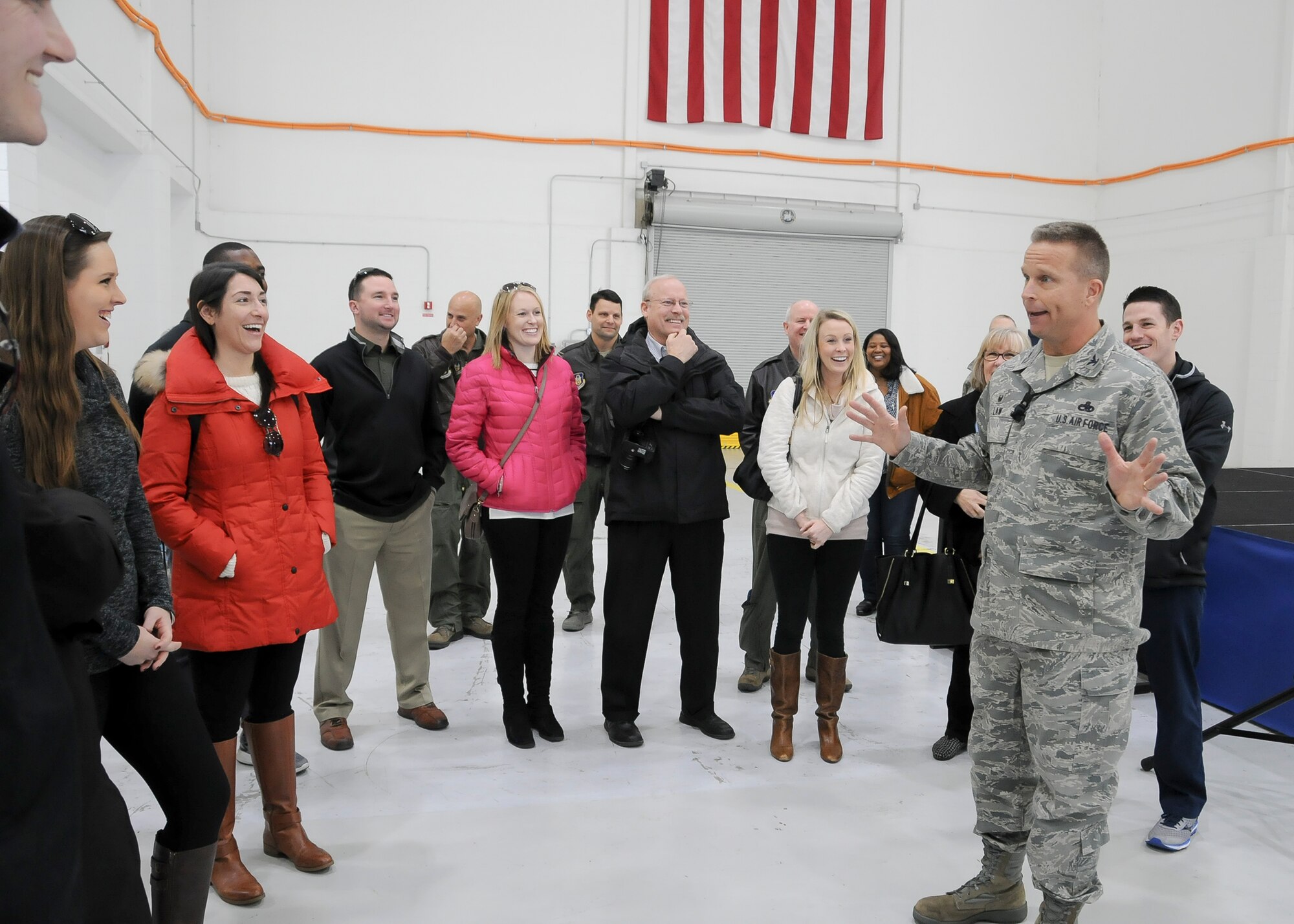 Colonel Roger Law, 459th Maintenance Group commander, briefs Baltimore Ravens staff members on the 459th ARW mission during a tour on the Joint Base Andrews, Maryland, flight line March 7, 2016. The 459th showcased missions to the group such as inflight refueling, maintenance, aerial port and aeromedical evacuation. (U.S. Air Force photo/Staff Sgt. Kat Justen)