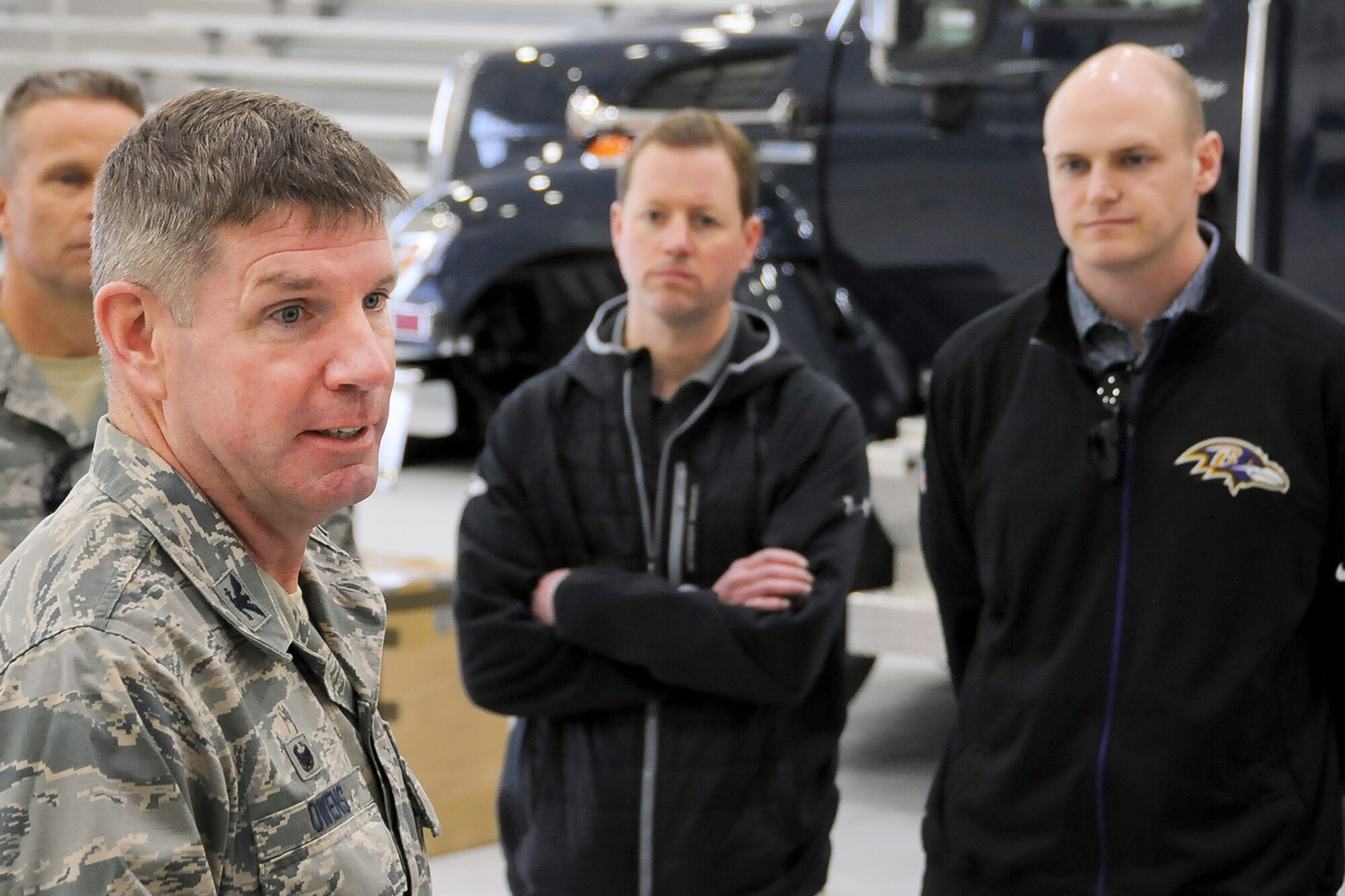 Colonel David A. Owens, 459th Air Refueling Wing commander, briefs Baltimore Ravens staff members on the 459th ARW mission during a tour on the Joint Base Andrews, Maryland, flight line March 7, 2016. The 459th showcased missions to the group such as inflight refueling, maintenance, aerial port and aeromedical evacuation. (U.S. Air Force photo/Staff Sgt. Kat Justen)