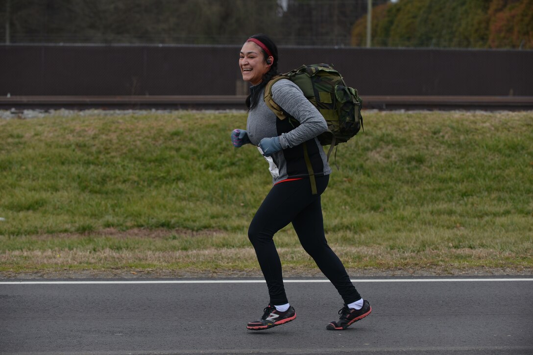 Jessica McGaugher participates in a 5K ruck march challenge at Fort Eustis, Va., March 5, 2016. This was the first year Fort Eustis incorporated a ruck march with the run as an effort to introduce different fitness practices to the community. (U.S. Air Force photo by Staff Sgt. Natasha Stannard)