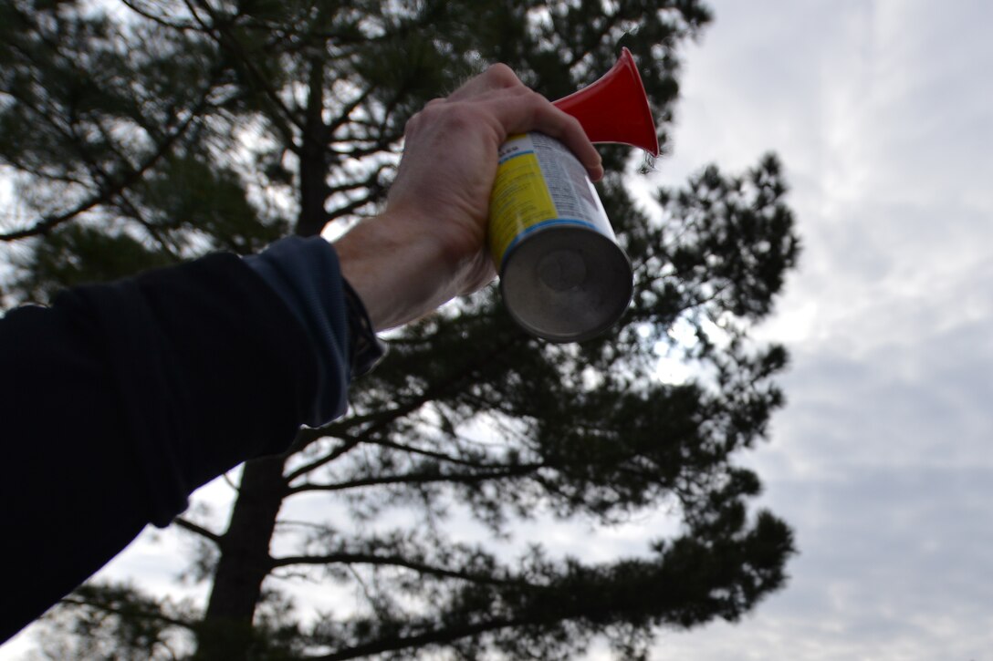 Jake Richmond, fitness director for the 633rd Force Support Squadron, sounds a horn to start the 18th Annual Fort Eustis 10K run and first 5K ruck march challenge at Fort Eustis, Va., March 5, 2016. Approximately 124 runner and 17 ruckers participated in this year’s event. (U.S. Air Force photo by Staff Sgt. Natasha Stannard) 